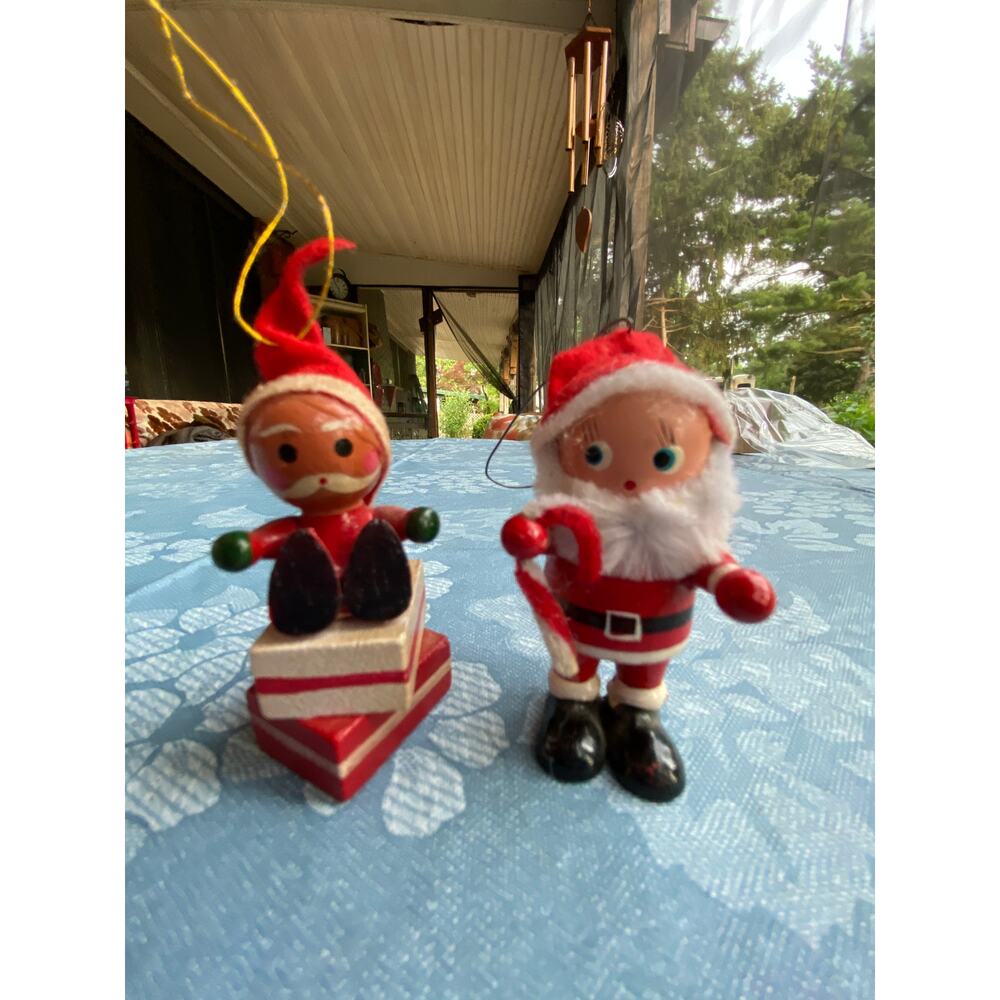 Set of 2 Wood Santa Claus Ornaments candy cane gifts1 beige skin, 1 brown skin